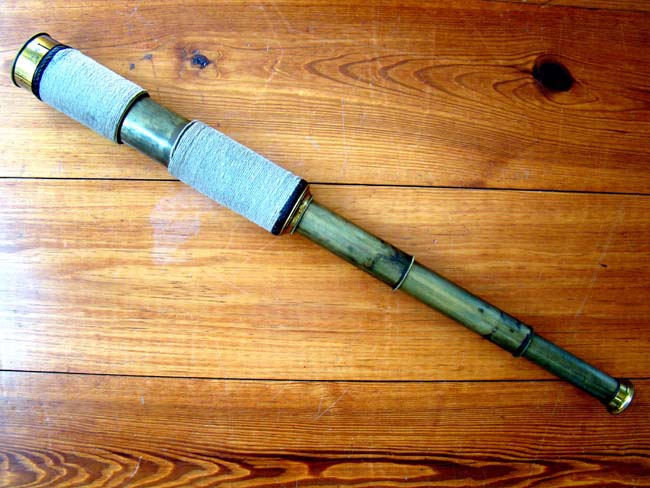 A 19th century three-draw telescope with rope wrapped barrel circa 1860